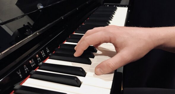 Piano keyboard showing the larger, more comfortable key surface area compared to traditional computer keyboards